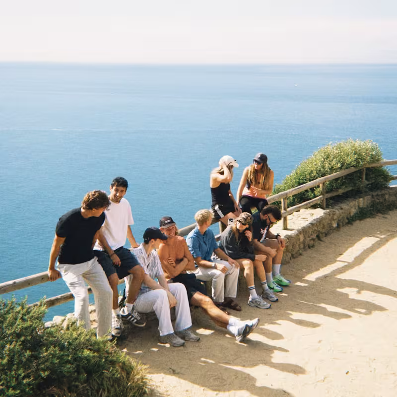 Members on a cliffside overlooking the ocean