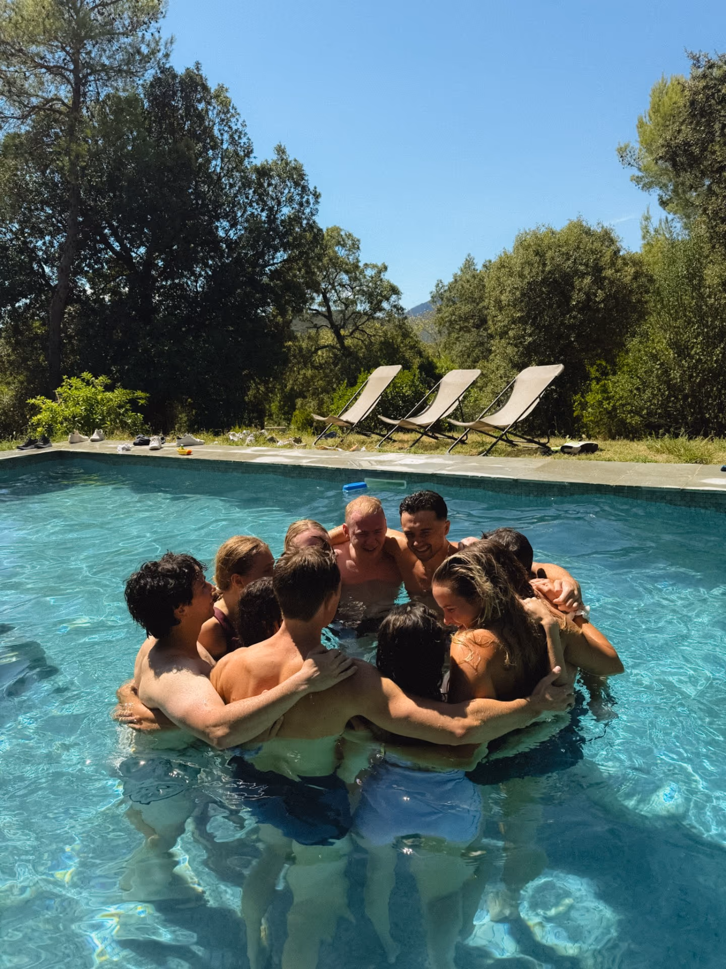 Group hug in the pool at a Provence residency