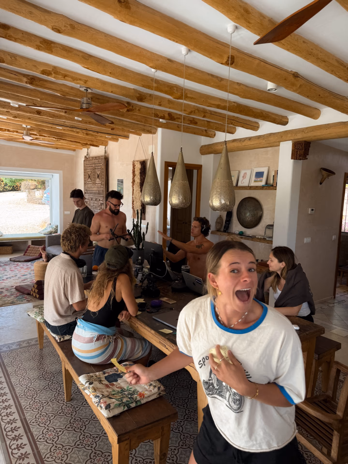 Founders working and laughing together inside a villa